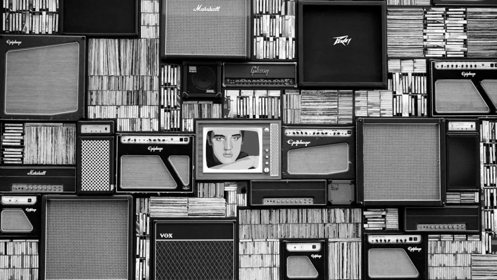 vintage amplifiers and vinyl records arranged in a striking black and white pattern. 114820 scaled large.jpeg.80